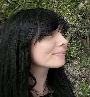 Sarah Tarbit, photographed in profile withblack hair with a fringe