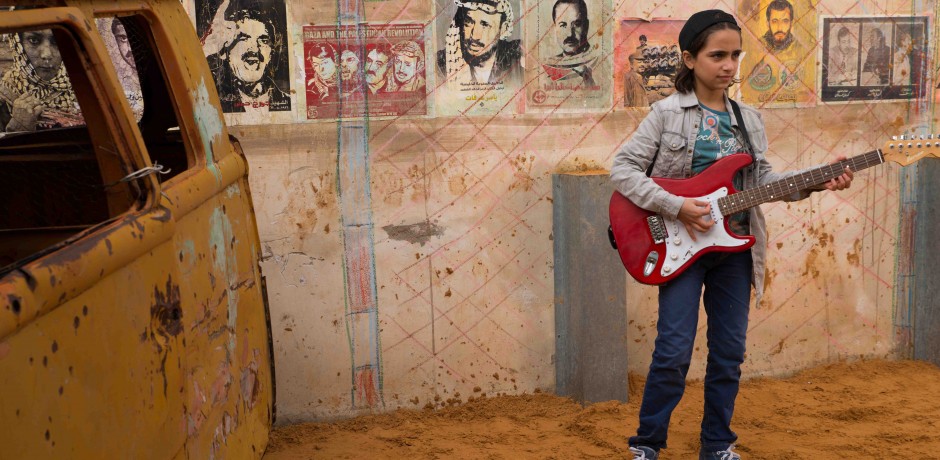 Still from The Idol of the main character playing the guitar