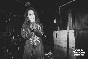 Black and White image of artist Cookie Love performing